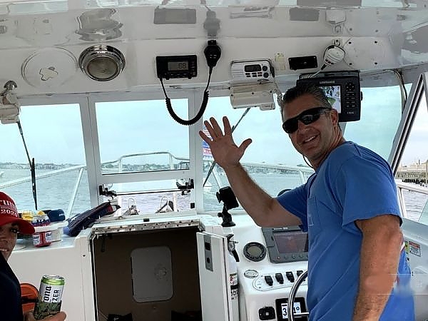  Captain waving from boat
