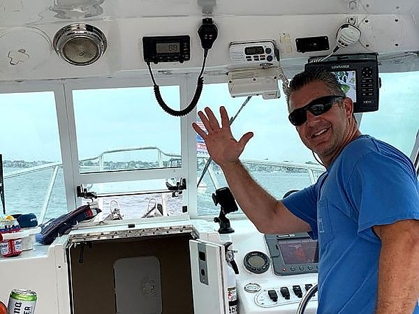  Captain waving from boat